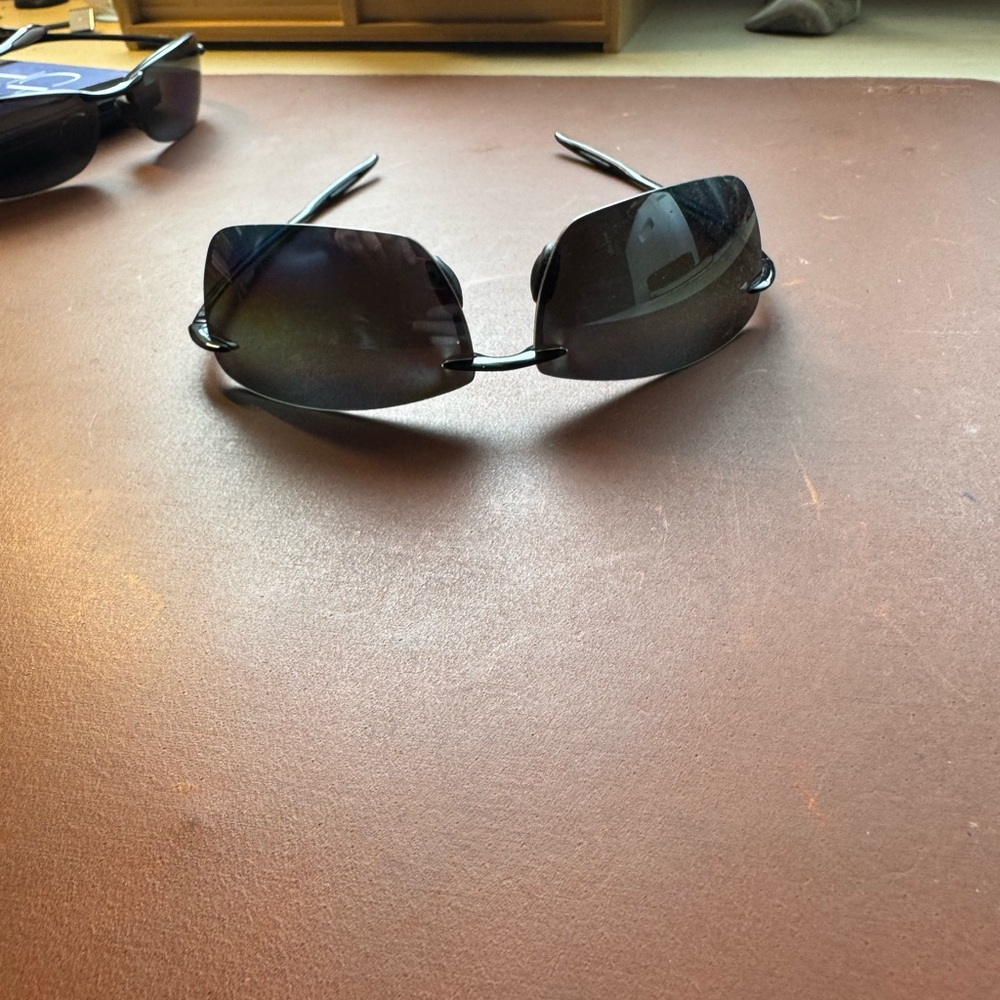 Sleek Black Rimless Sunglasses. Maui Jim’s Lighthouse